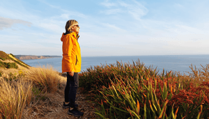 woman-looking-out-over-cliff